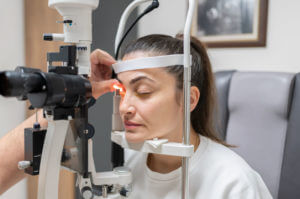 An Ophthalmologist Examining Female Patient Eye for Glaucoma With A Laser Slit Lamp At Clinic.